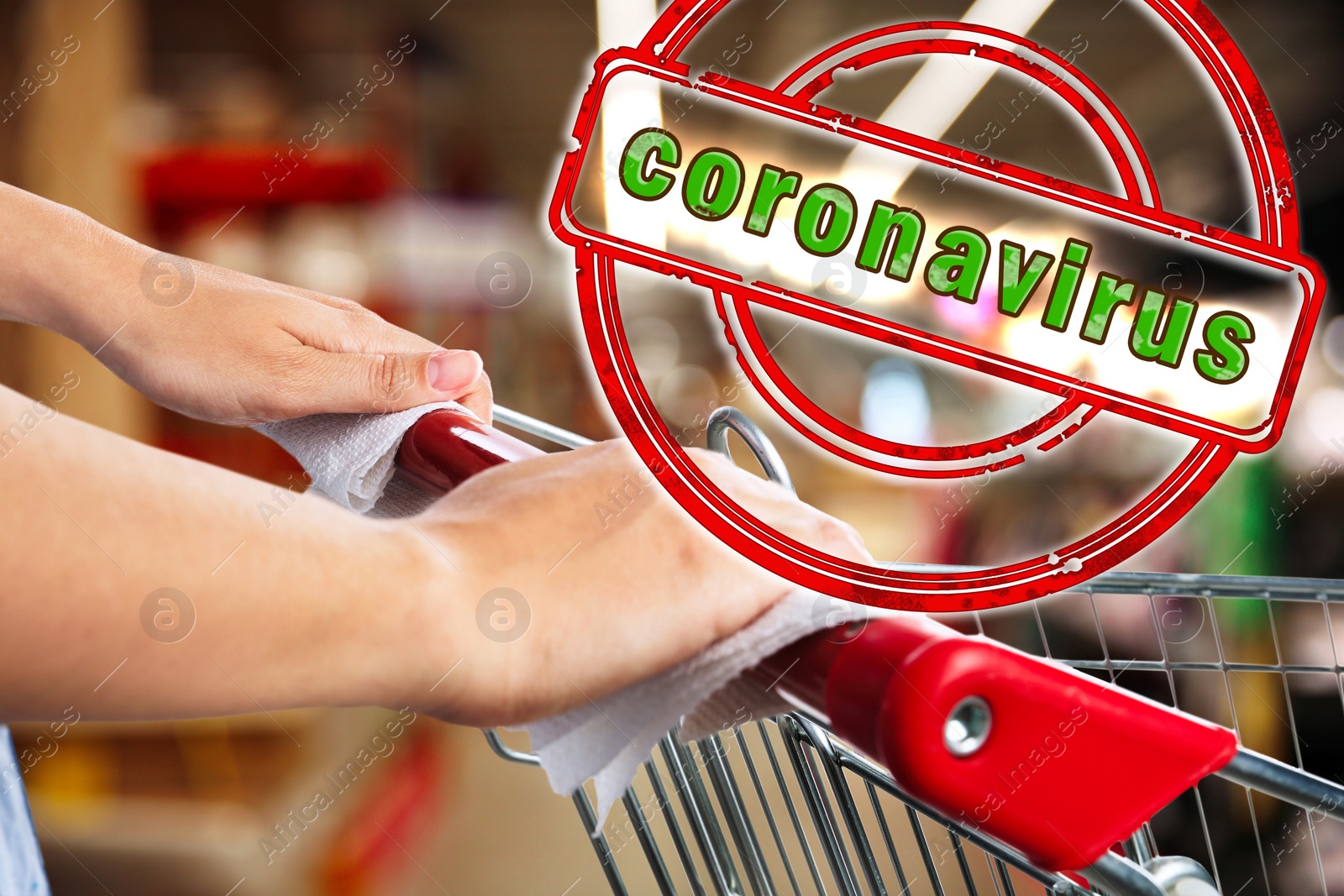 Image of Woman holding shopping cart handle with tissue paper at supermarket, closeup. Preventive measure in public places during coronavirus outbreak