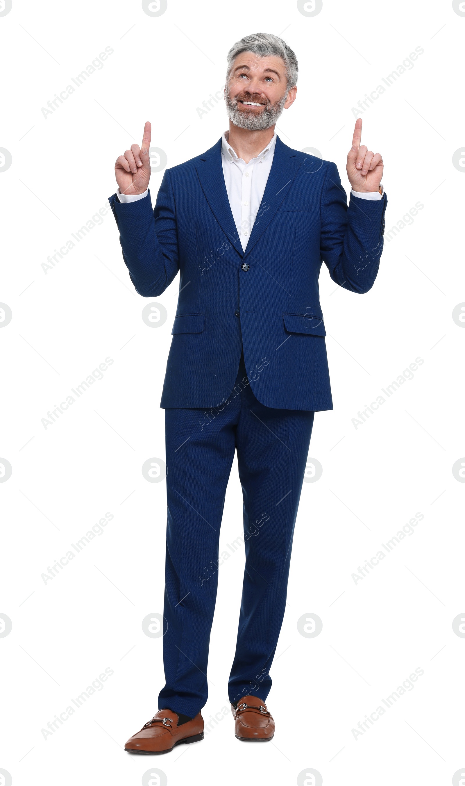 Photo of Mature businessman in stylish clothes posing on white background