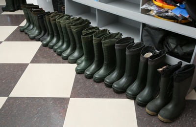 Photo of Footwear for fishing on floor in sports shop