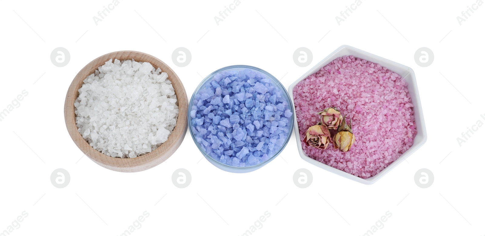 Photo of Different sea salt and dry rose flowers isolated on white, top view