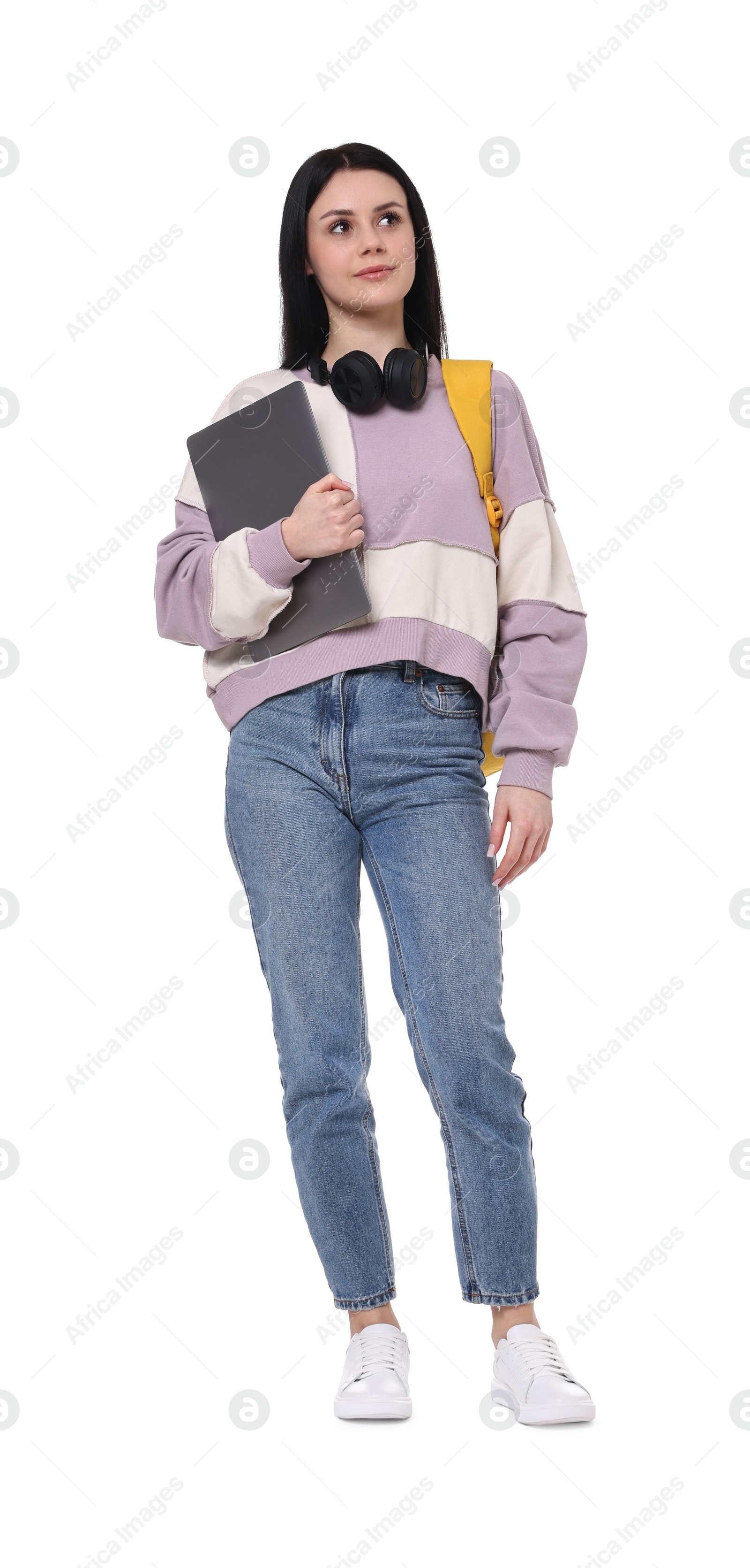 Photo of Student with backpack and laptop on white background