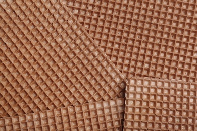 Tasty wafers as background, closeup. Crispy food