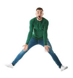 Photo of Full length portrait of emotional man jumping on white background
