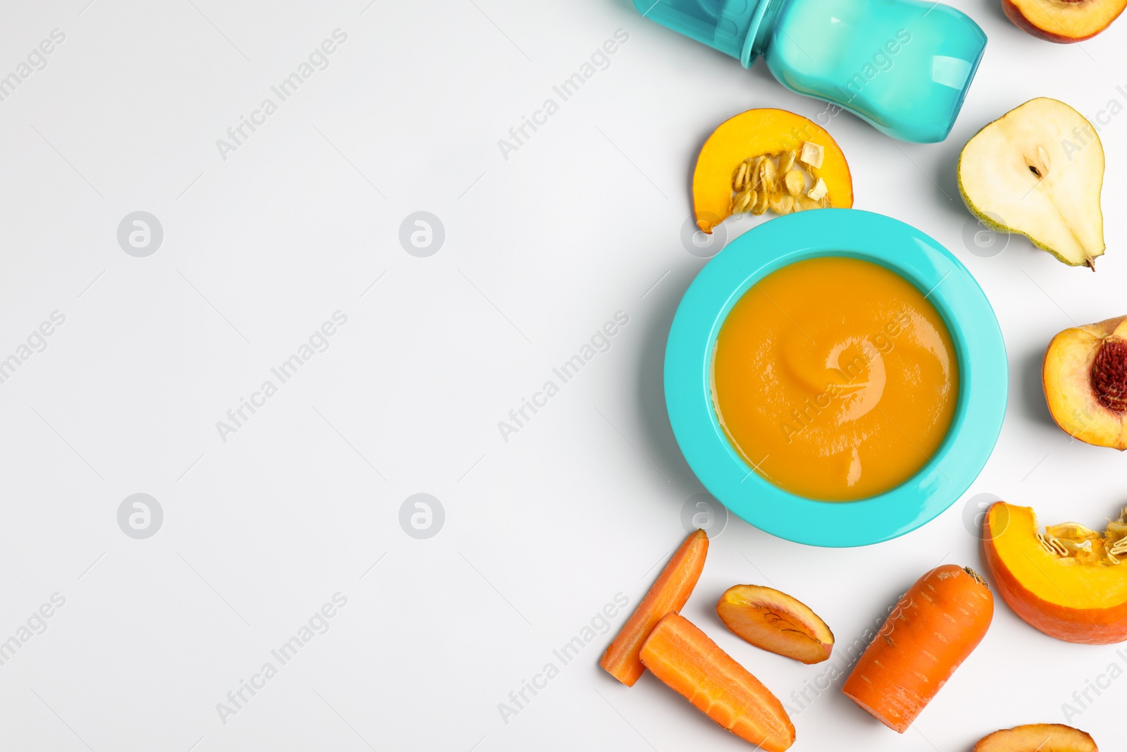 Photo of Flat lay composition with healthy baby food and ingredients on white background. Space for text