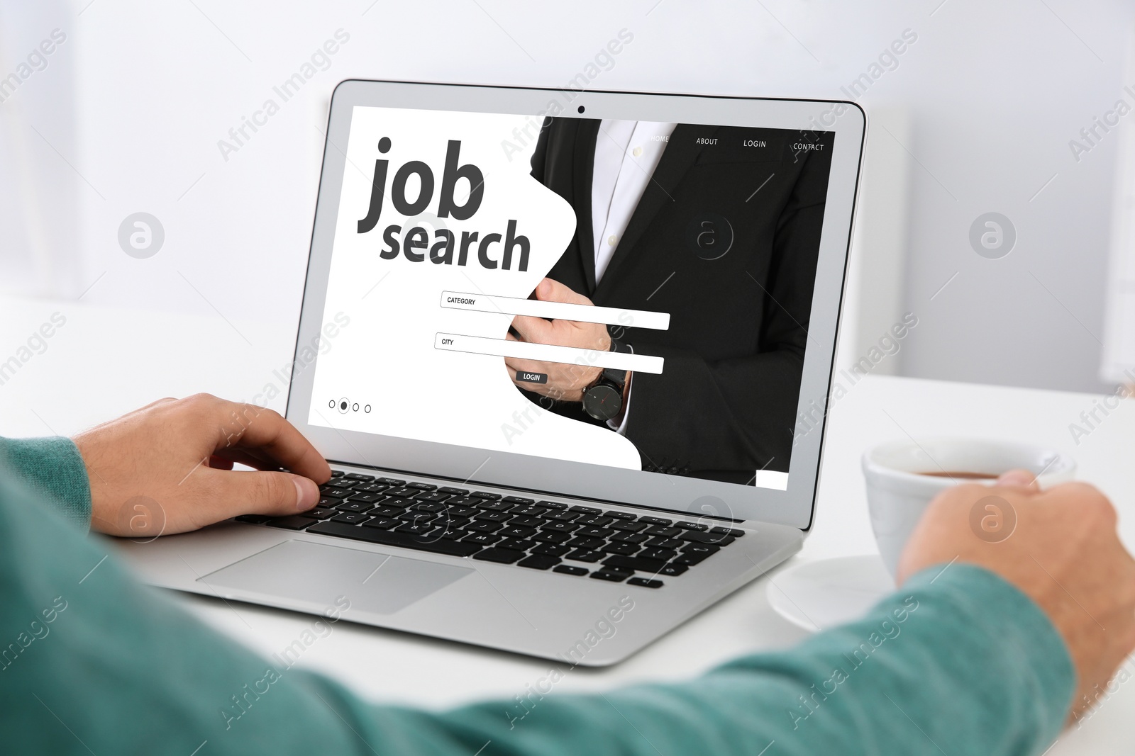 Image of Man searching job with laptop at table, closeup 