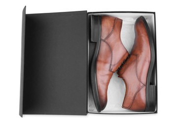 Pair of stylish leather shoes in black box on white background, top view