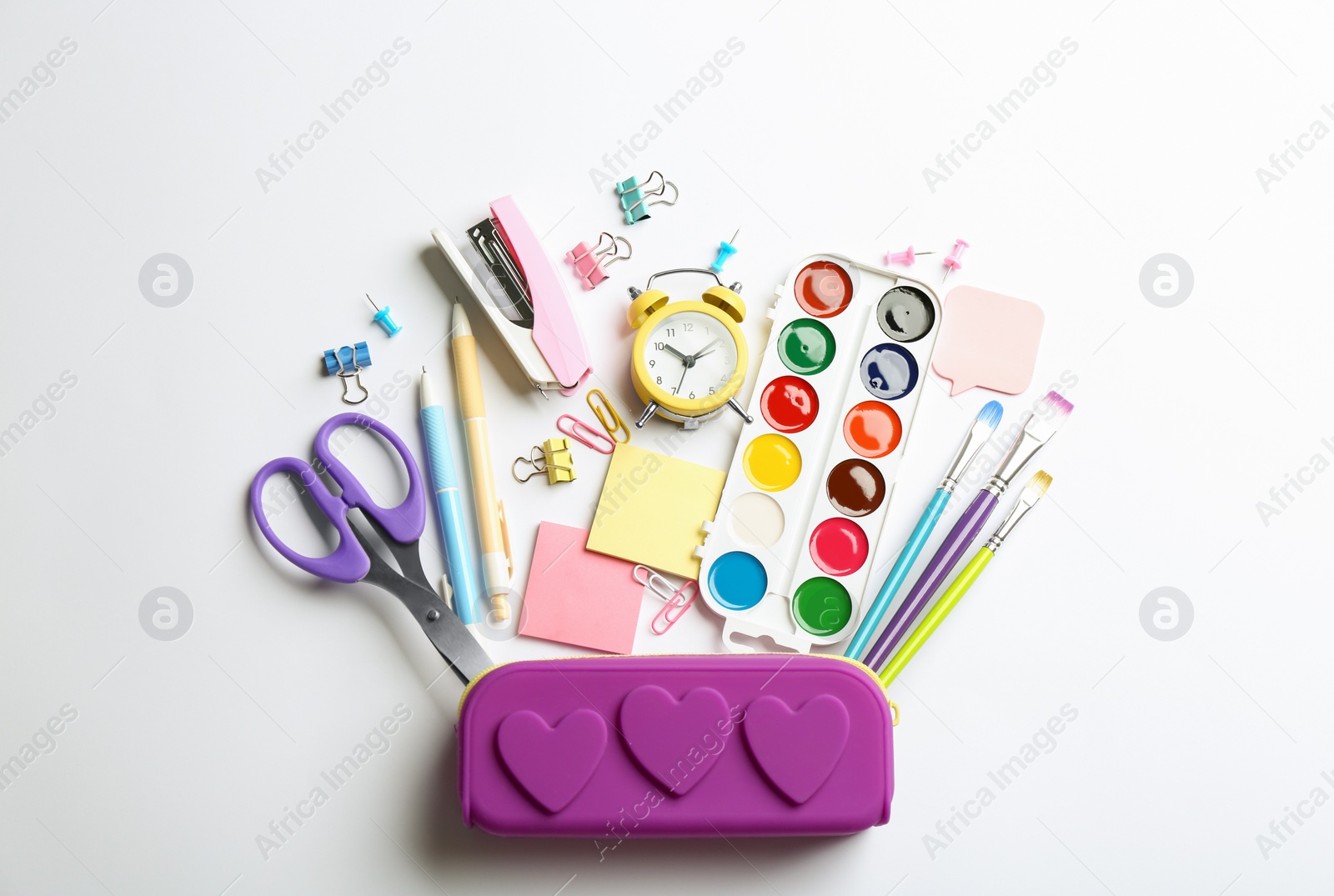 Photo of Flat lay composition with school stationery on white background. Back to school