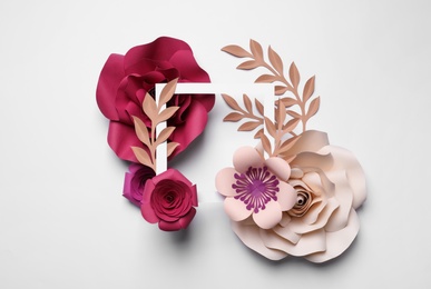 Photo of Different beautiful flowers made of paper and frame on light background, flat lay