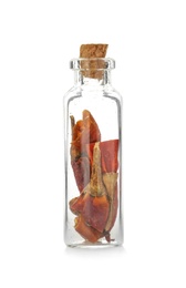 Glass bottle with spice on white background