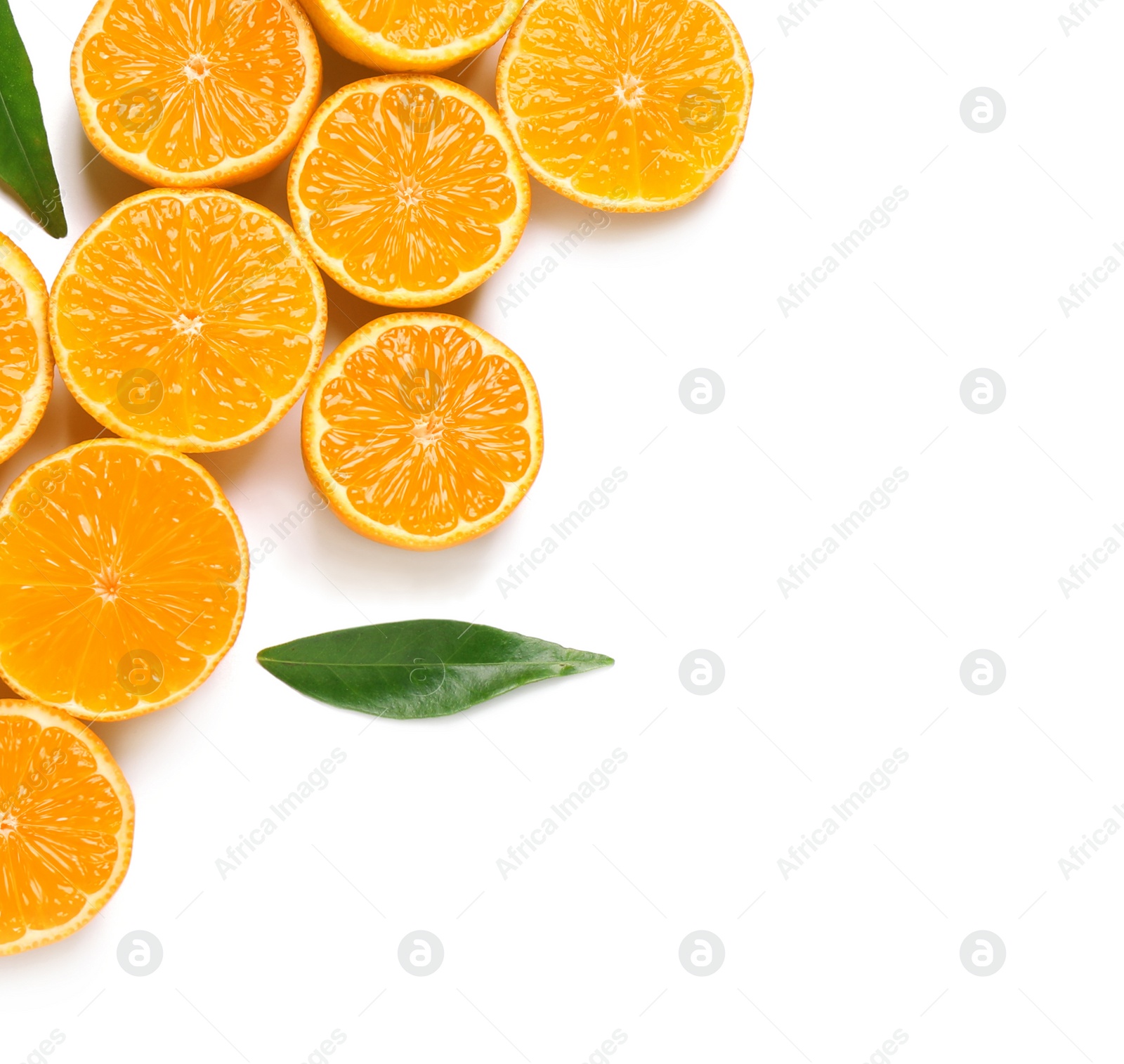 Photo of Composition with halves of fresh ripe tangerines and leaves on white background, top view. Citrus fruit