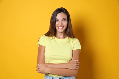 Photo of Portrait of beautiful woman on yellow background