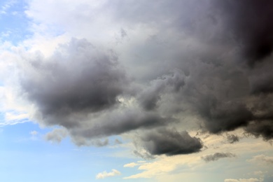 Sky with heavy rainy clouds on grey day