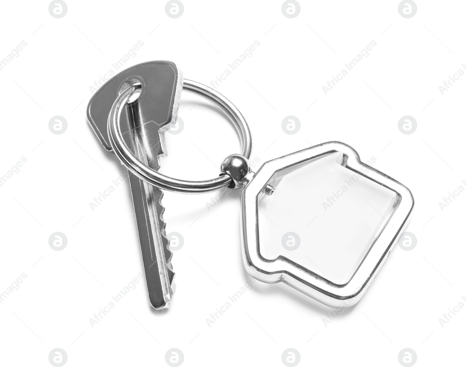 Photo of House key with trinket on white background