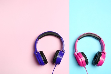 Stylish modern headphones on color background, flat lay. Space for text