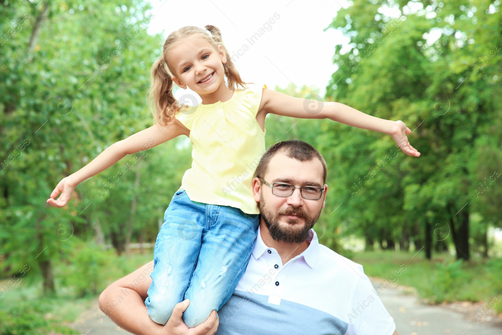 Photo of Father with his child outdoors. Happy family