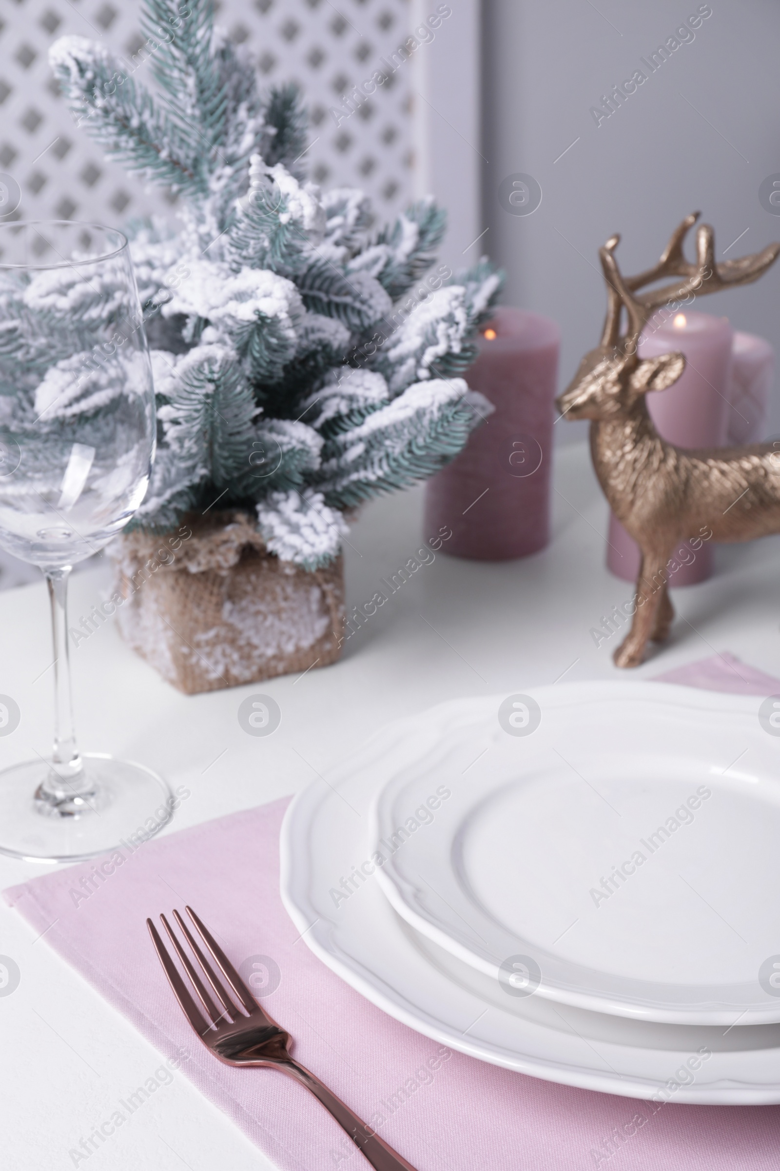 Photo of Stylish table setting and festive decor on white background