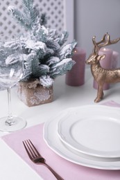 Stylish table setting and festive decor on white background