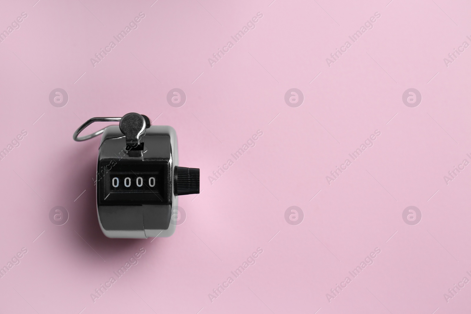 Photo of Modern timer on pink background, top view. Space for text