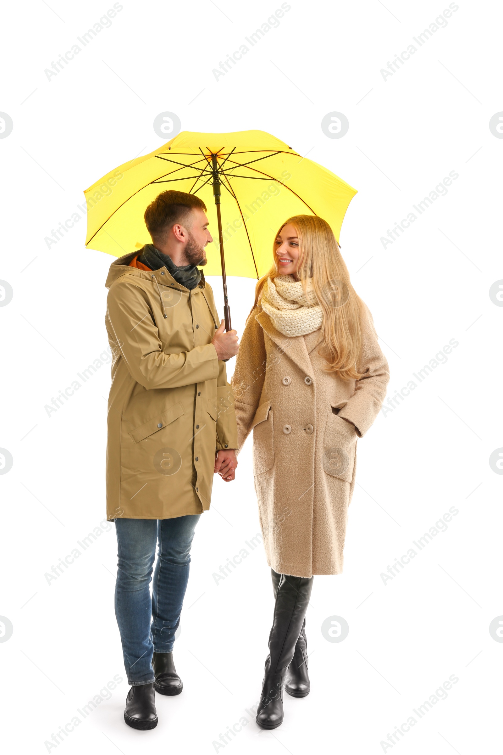 Photo of Full length portrait of beautiful couple with umbrella, isolated on white