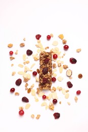 Tasty granola bar and ingredients isolated on white, top view