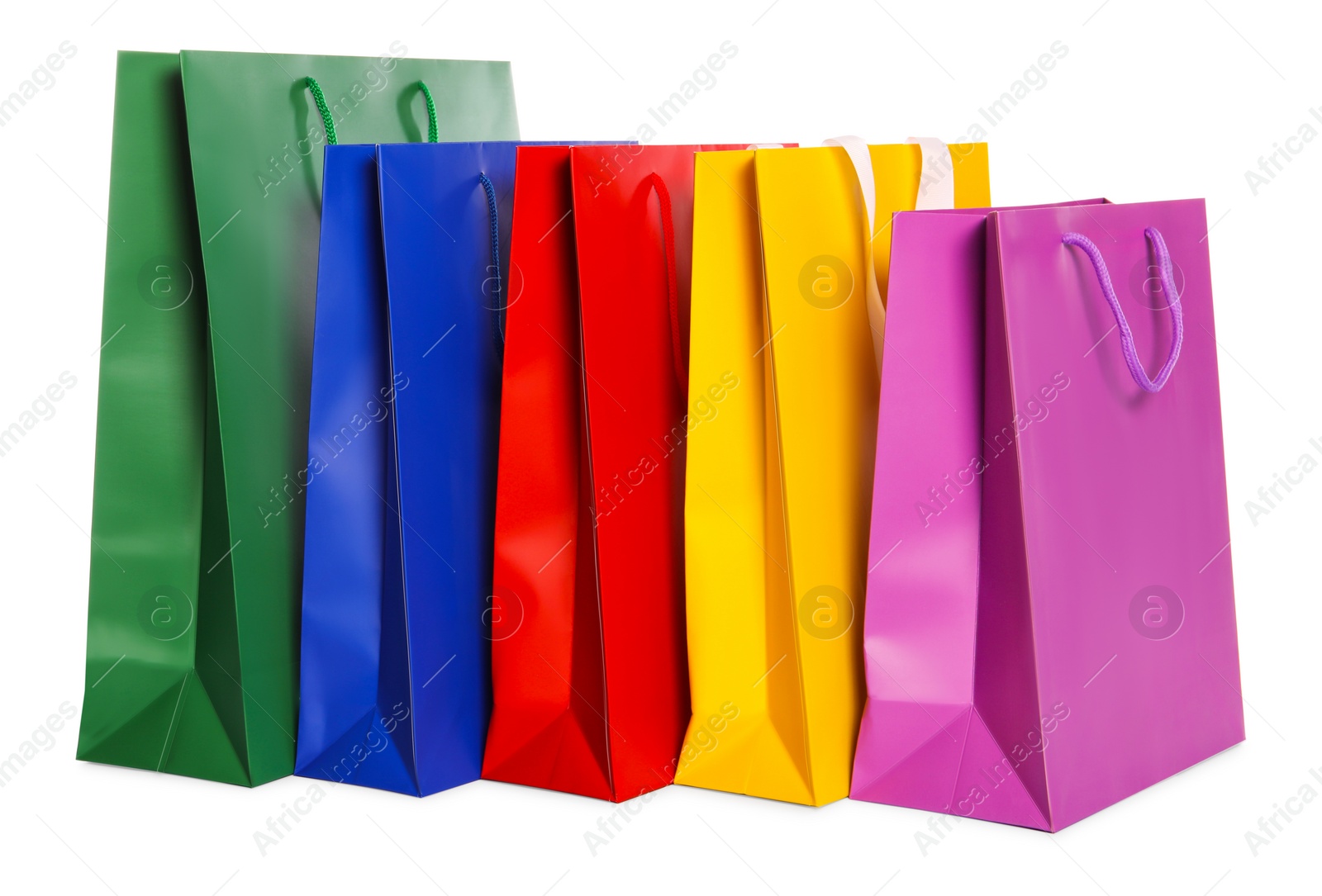 Photo of Colorful paper shopping bags isolated on white