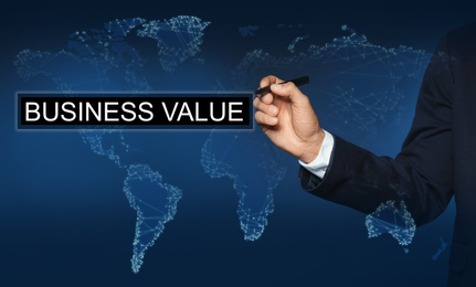Image of Business value concept. Man using virtual screen