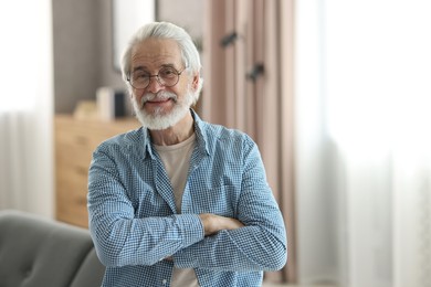 Portrait of happy grandpa with glasses indoors