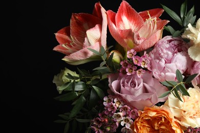 Beautiful bouquet of fresh flowers on dark background