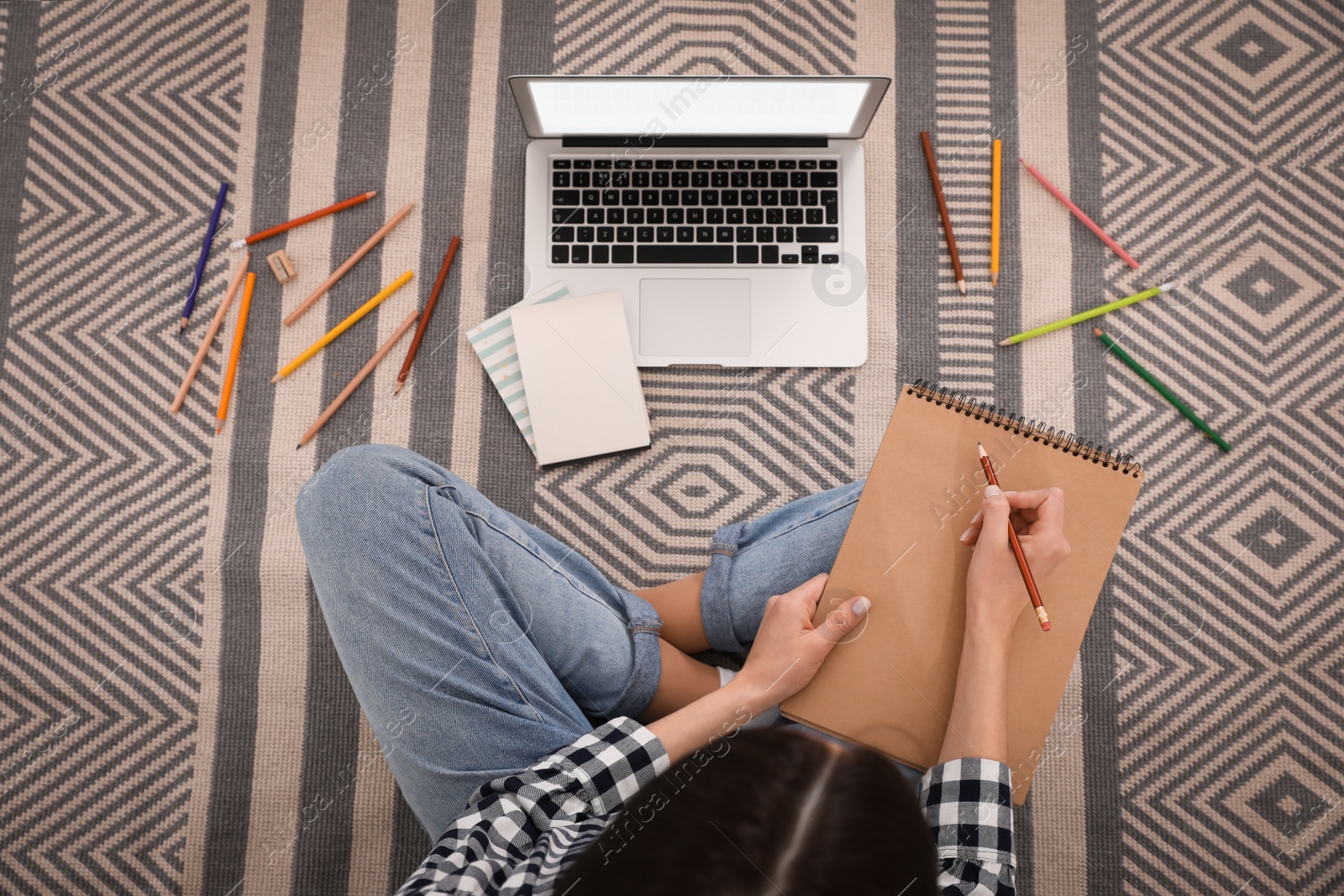 Photo of Woman drawing picture at online art lesson indoors, top view. Distant learning