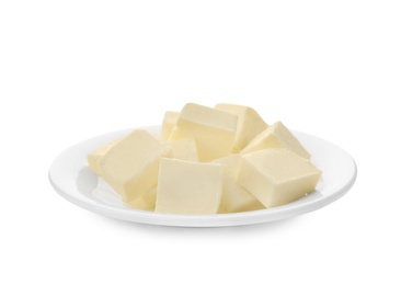 Photo of Plate with cubes of tasty fresh butter on white background