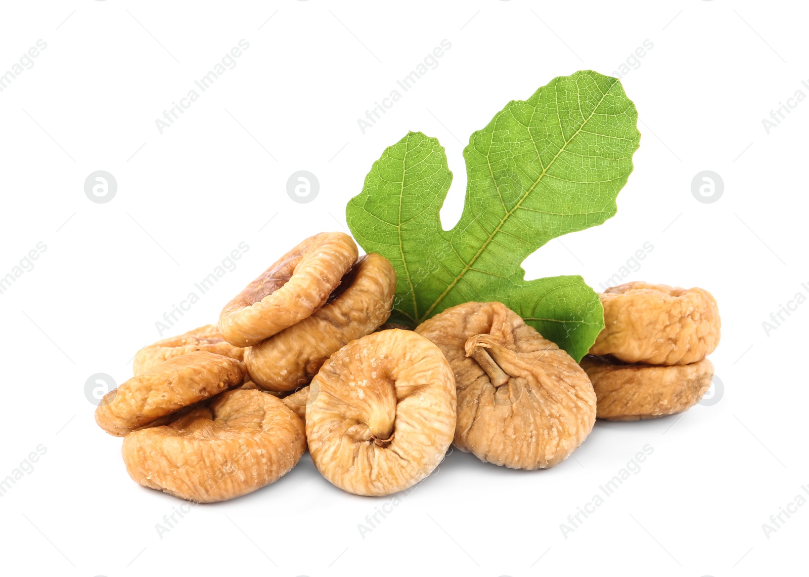 Photo of Tasty dried figs and green leaf isolated on white