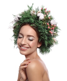 Happy young woman wearing wreath on white background