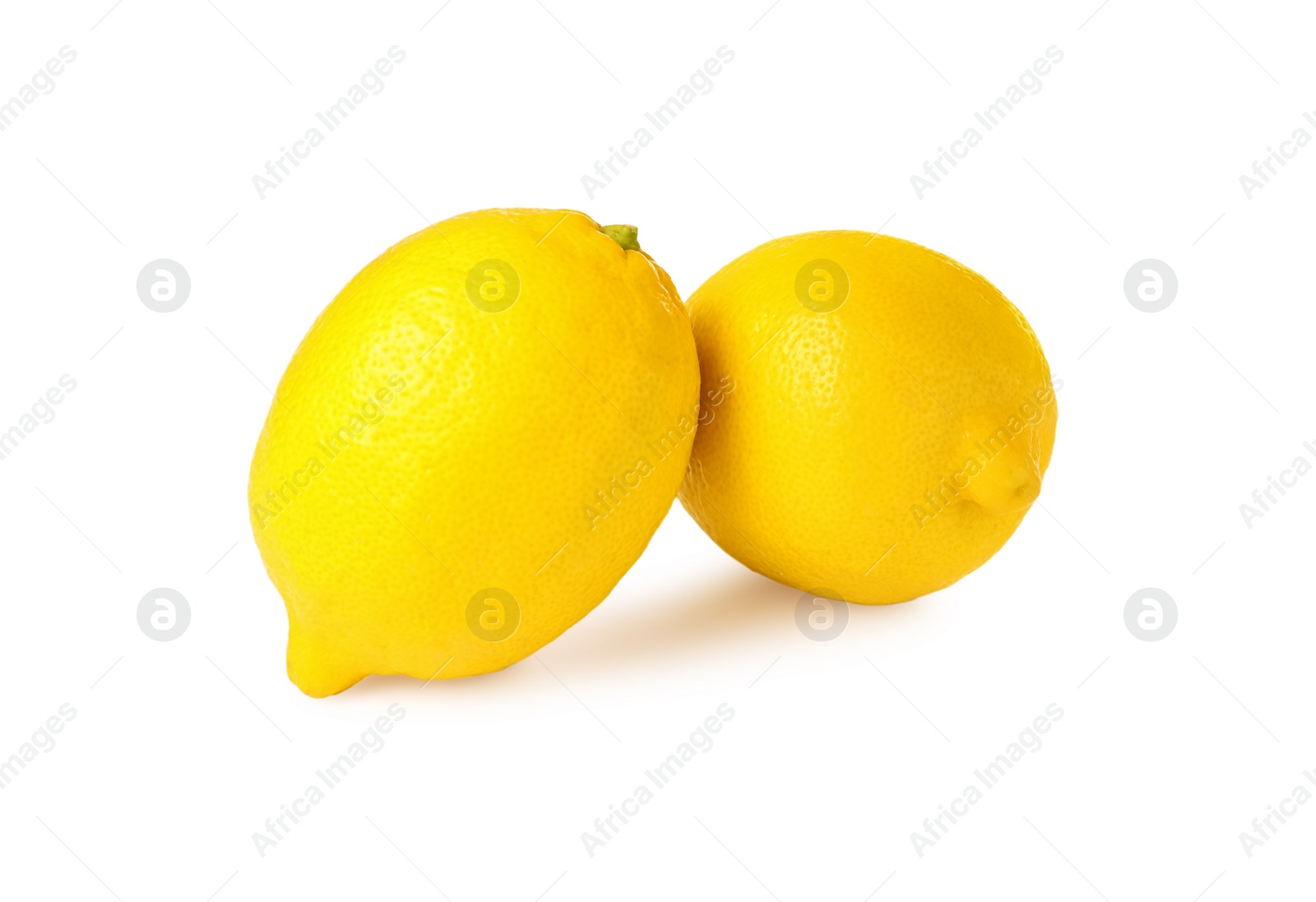 Photo of Two fresh ripe lemons isolated on white