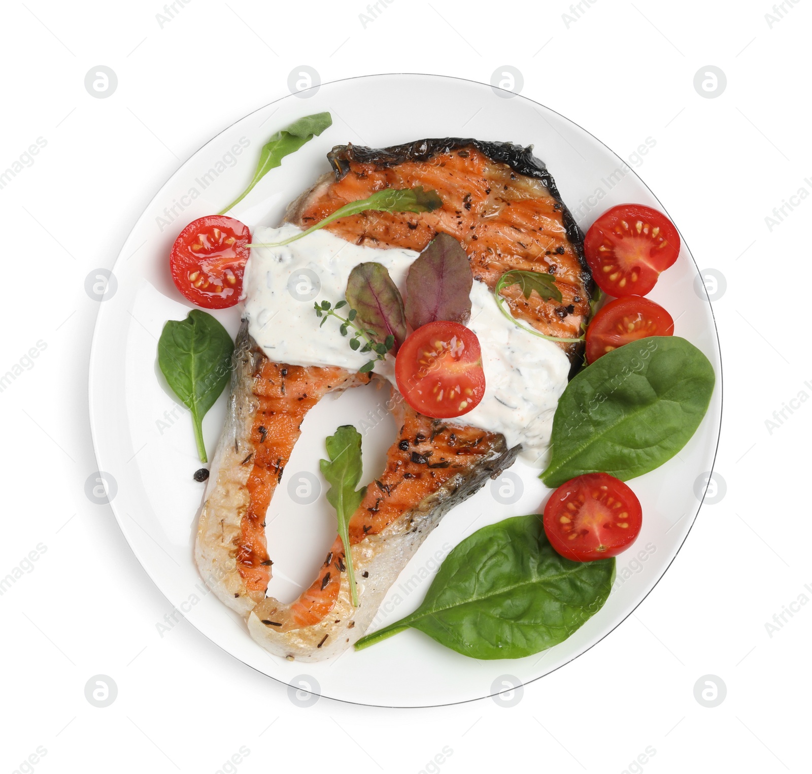 Photo of Tasty salmon steak with basil and tomatoes on white background, top view