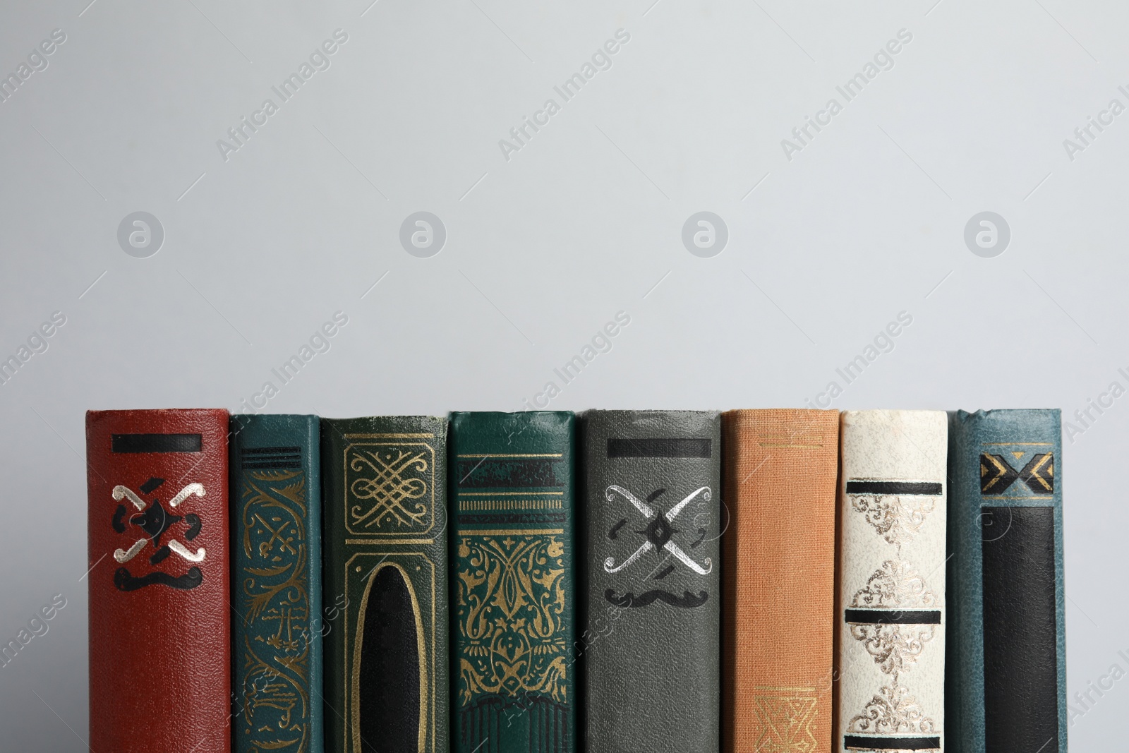 Photo of Collection of old books on light background