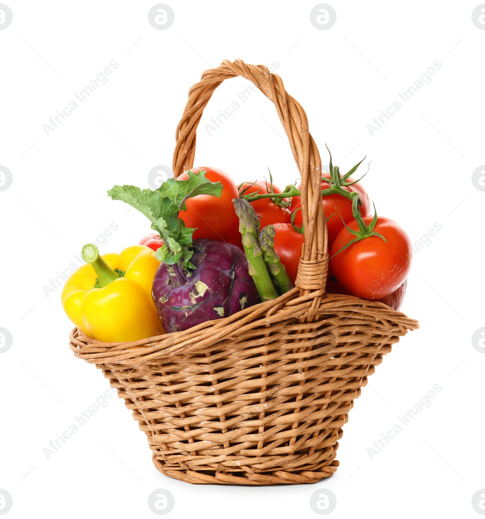 Photo of Fresh ripe vegetables in wicker basket on white background