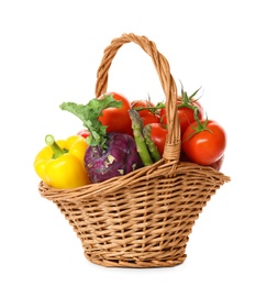 Fresh ripe vegetables in wicker basket on white background