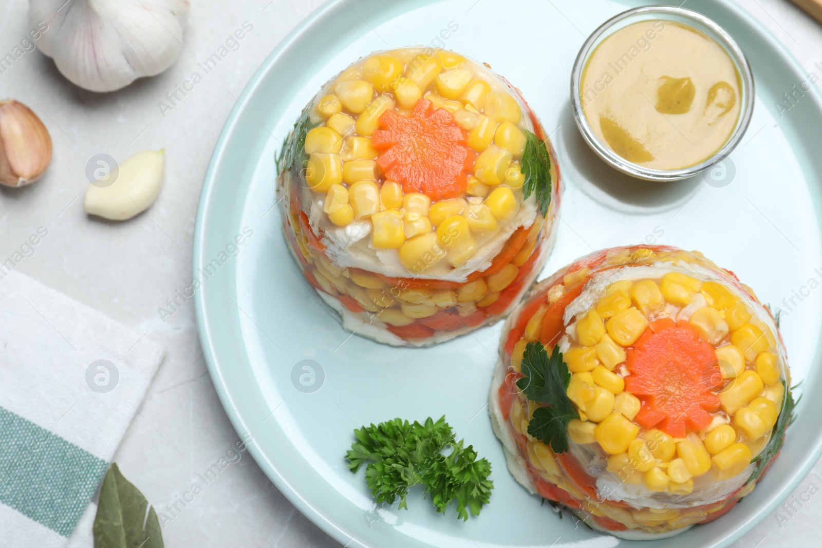 Photo of Delicious fish aspic served on light table, flat lay