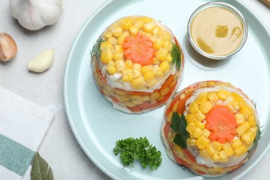 Delicious fish aspic served on light table, flat lay