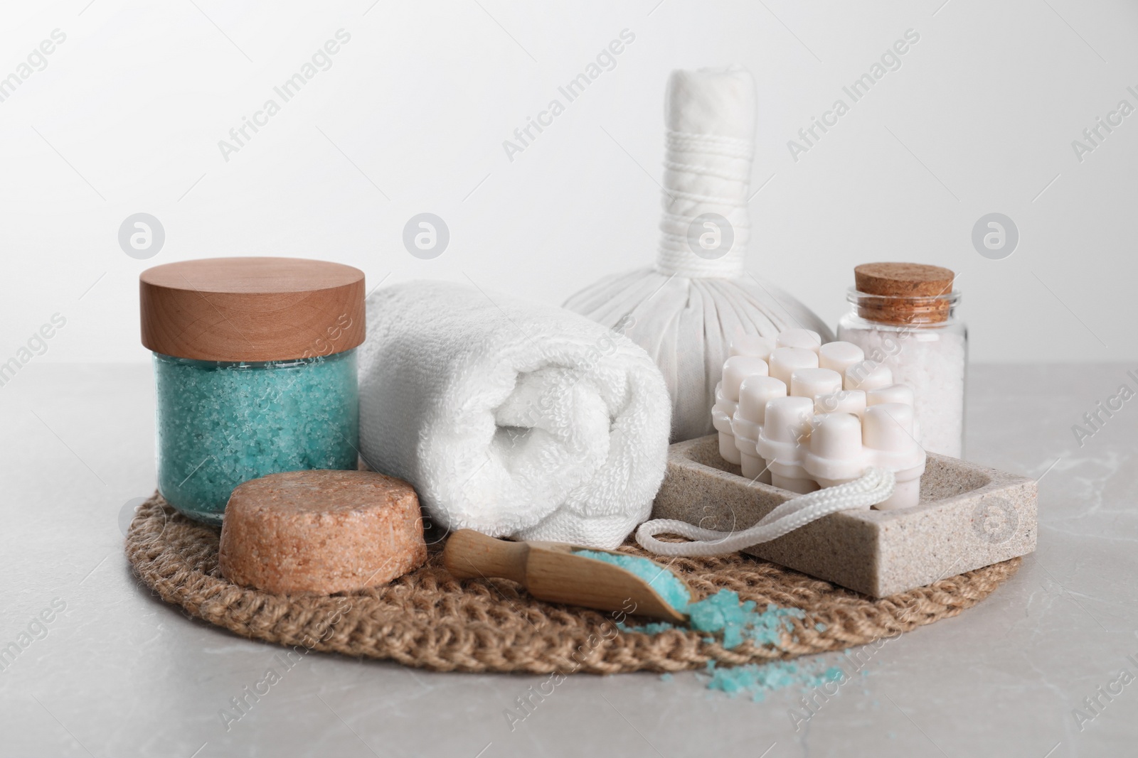Photo of Spa composition with care products on light grey marble table