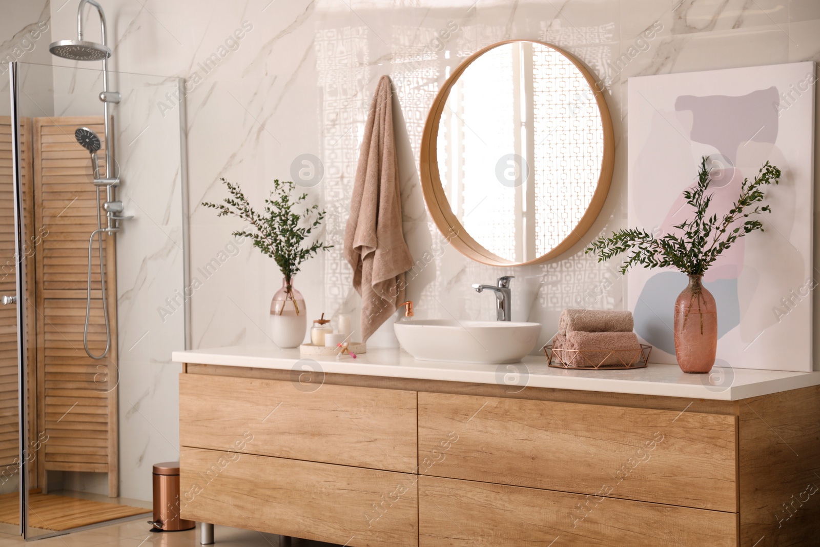 Photo of Modern bathroom interior with stylish mirror and vessel sink