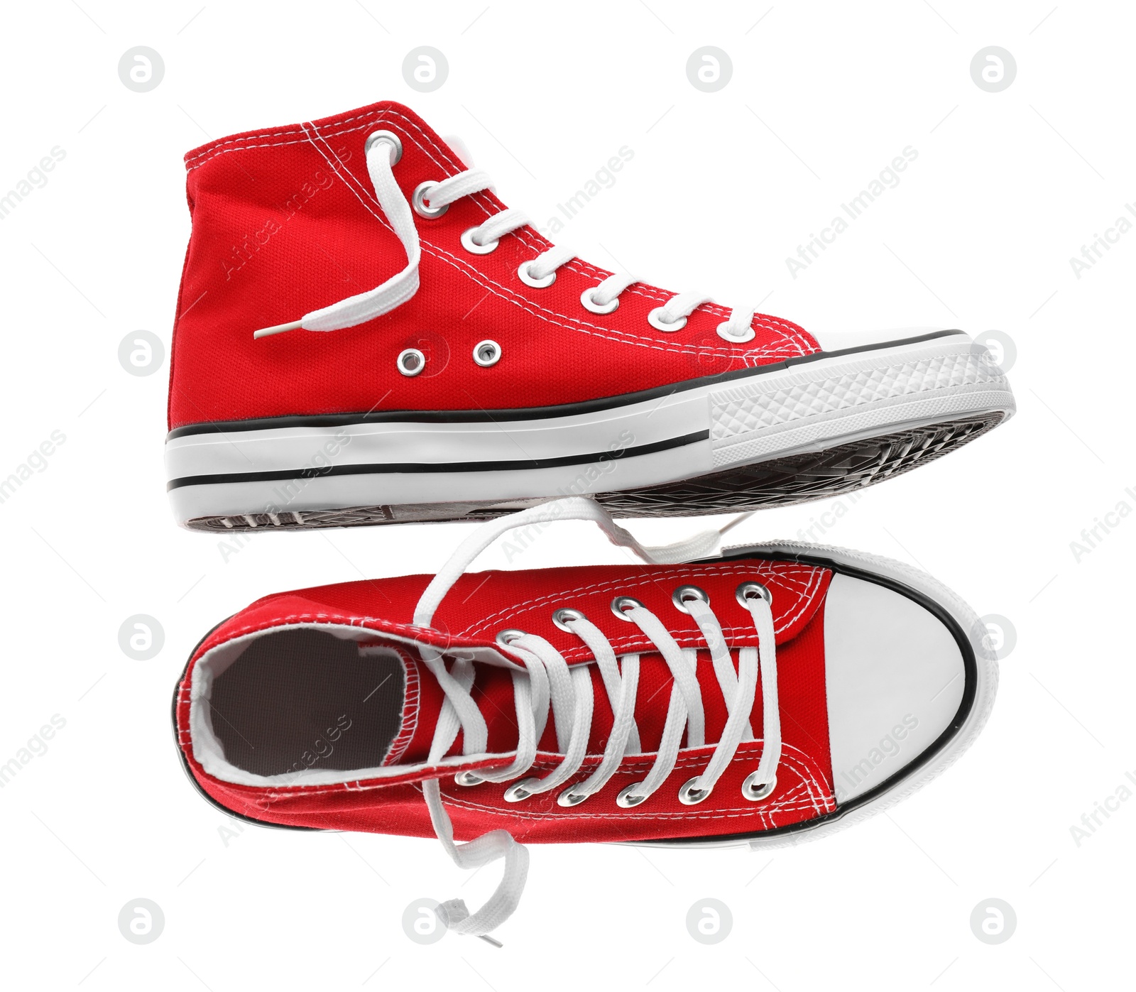 Photo of Pair of trendy sneakers isolated on white, top view