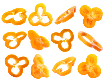 Set of cut ripe orange bell peppers on white background