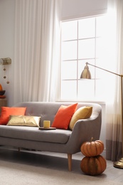 Photo of Cozy living room interior inspired by autumn colors