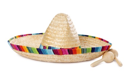 Photo of Mexican sombrero hat and maracas isolated on white