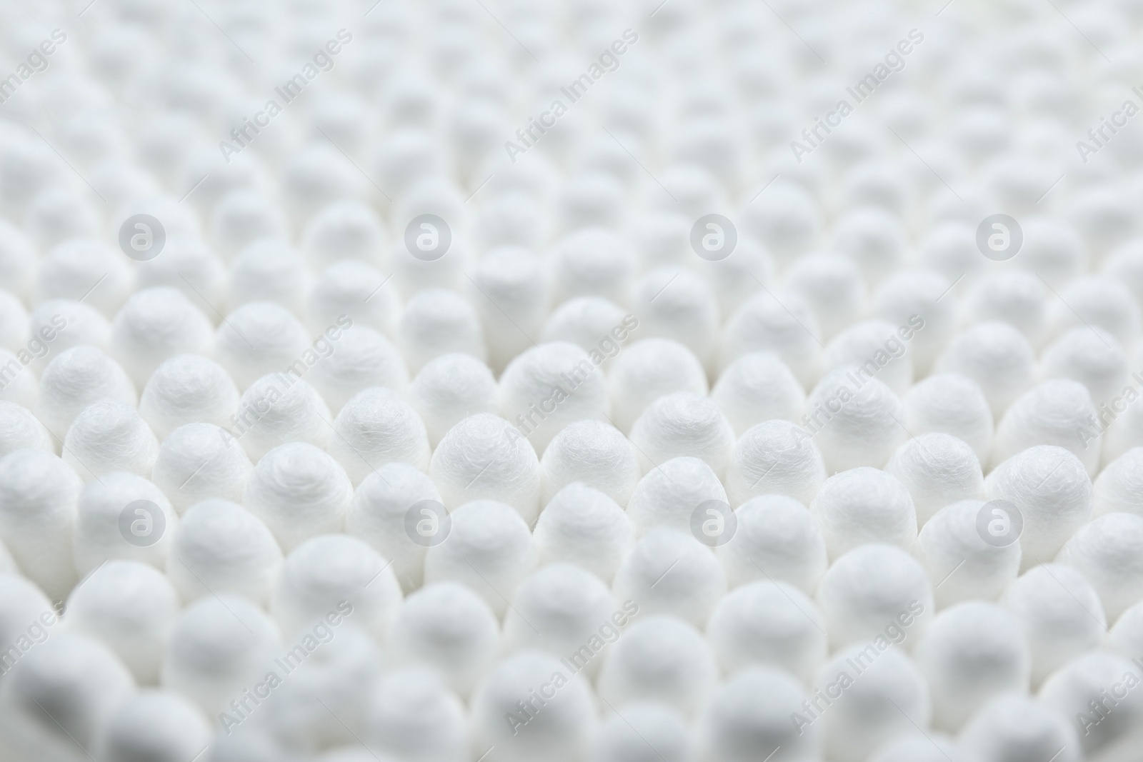 Photo of Many cotton buds as background, closeup view