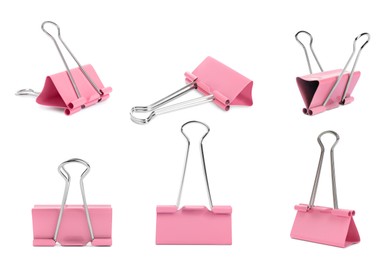 Set with pink binder clips on white background