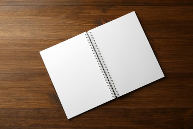 Blank paper brochure on wooden table, top view. Mockup for design