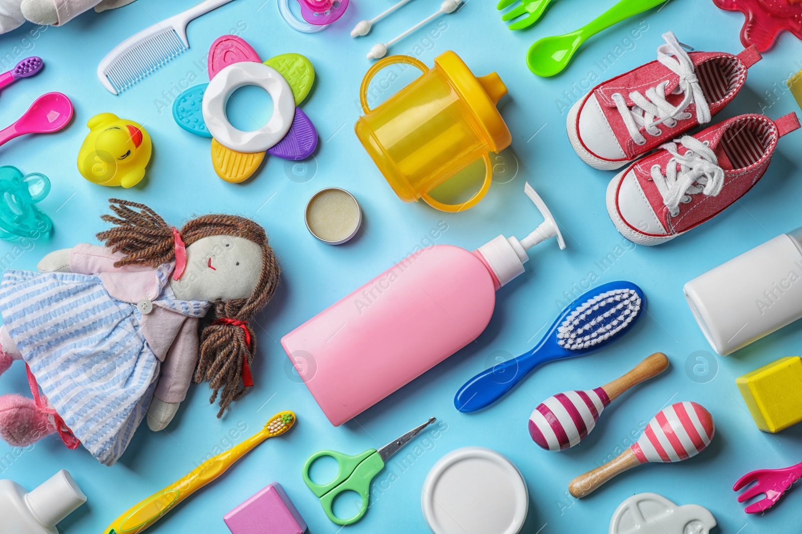 Photo of Flat lay composition with baby accessories and toys on color background