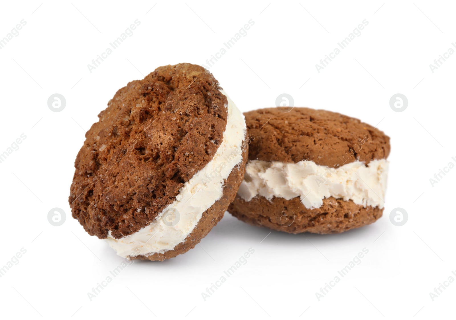 Photo of Sweet delicious ice cream cookie sandwiches on white background